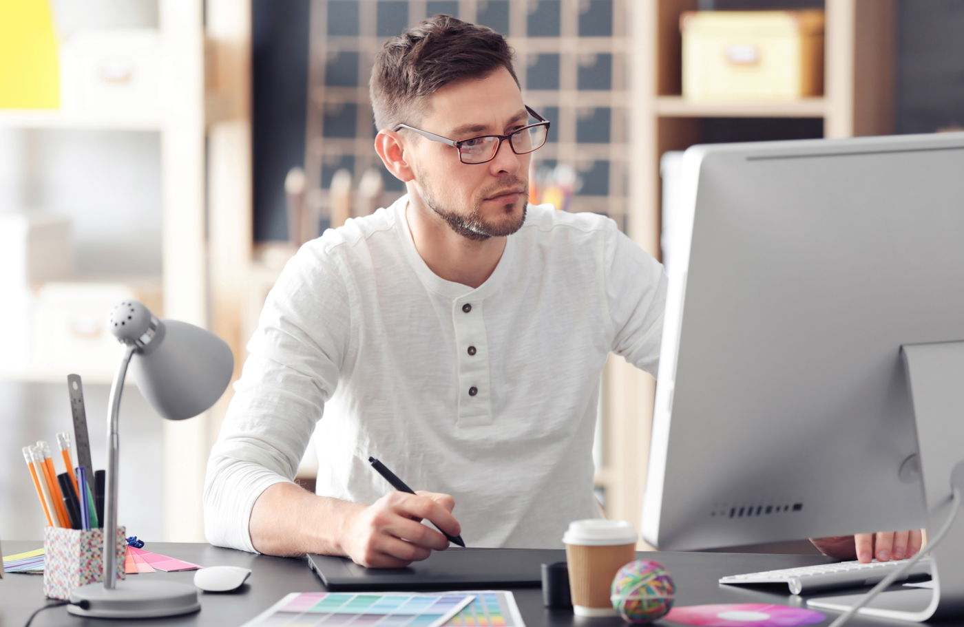 Comparison of web designer creative work and web developer coding side by side.